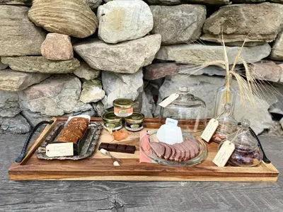 a tray with different types of food on it at Glamping 4 saisons @ Eco Lodge Bûcheron Bergère in Ormstown