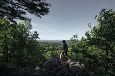 a man standing on top of a rock at Cabin Zoobox 75 in Eastman