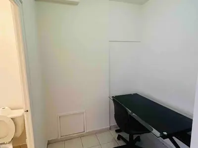 a bathroom with a ping pong table and a toilet at Stylish Montreal Apartment: Comfortable Stay in the Golden Square Mile in Montréal