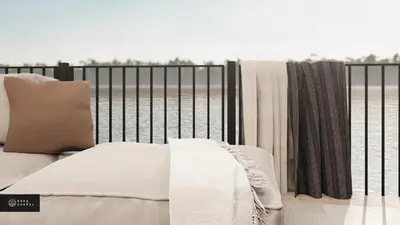 a bed sitting on top of a iron fence at MiniBora Le beaumier - Cantons-de-l'Est in Bury
