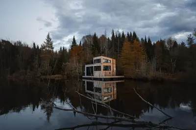 a house in the middle of a body of water at MiniBora Le ciel - Cantons-de-l'Est in Bury