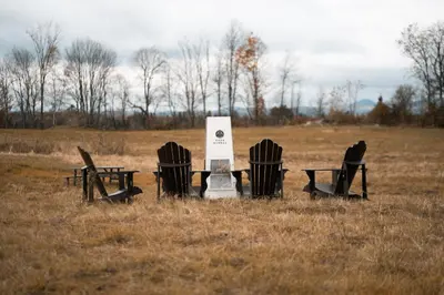 a group of chairs and tables in a field at MiniBora Le moka - Cantons-de-l'Est in Bury