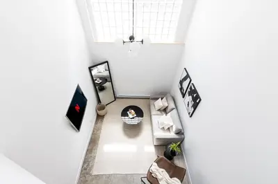 an overhead view of a living room with a couch at Le Mile End by M11 - Luxury 1BDR Loft with Sofa Bed in Montréal