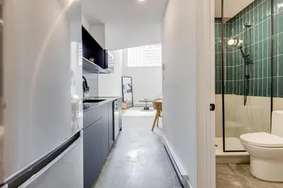 a bathroom with a toilet and a sink at Le Mile End by M11 - Modern & Stylish 1BDR with Sofa Bed in Montréal