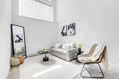a living room with a couch and a chair at Le Mile End by M11 - Modern & Stylish 1BDR with Sofa Bed in Montréal