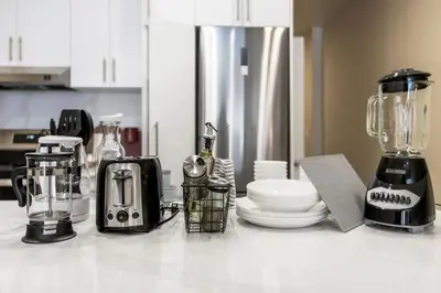 a kitchen counter with appliances on a counter top at City Center King Suite in Montréal