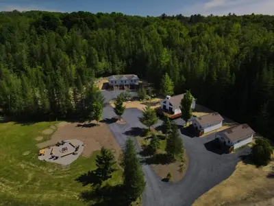 an aerial view of a house in the woods at Chalet 1 OST Shefford in Shefford