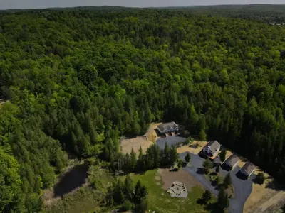 an aerial view of a house in the woods at Chalet 2 OST Shefford in Shefford