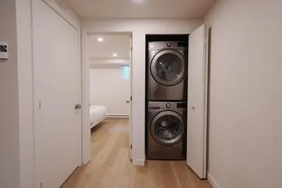 a laundry room with a washer and dryer at Chalet 5 OST Shefford in Shefford