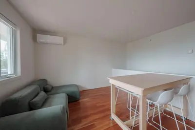 a living room with a couch and a table at Chalet 5 OST Shefford in Shefford