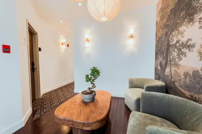a living room with two chairs and a table at Self Check-In Boutique Hotel - Quartier latin - Room 202 in Montréal