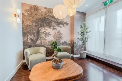 a living room with a table and two chairs at Self Check-In Boutique Hotel - Quartier latin - Room 301 in Montréal