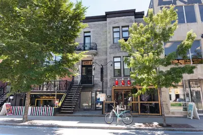 a building with a bike parked in front of it at #3 - Chic Studio - Self Check in - Plateau - St-Denis - AC - TV in Montréal