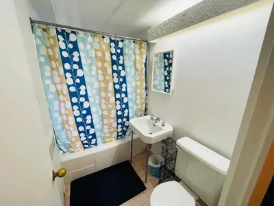 a bathroom with a toilet and a sink at Stylish Montreal Apartment Comfortable Stay in the Golden Square Mile in Montréal