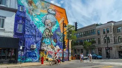 a mural on the side of a building on a street at Three bedroom chic condo downtown Montreal in Montréal