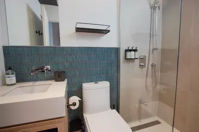 a bathroom with a toilet and a sink and a shower at Studio #5 - Self Check-In - Plateau - St-Denis in Montréal