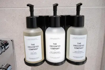 three bottles of the unexpected company products on a counter at Studio #6 - Self Check-In - Plateau - St-Denis in Montréal