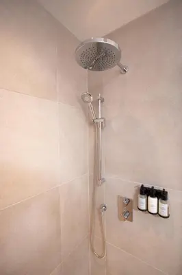 a shower with a shower head in a bathroom at Studio #6 - Self Check-In - Plateau - St-Denis in Montréal
