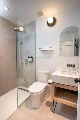 a bathroom with a toilet and a shower and a sink at Studio #11 - Self Check-In - Plateau - St-Denis in Montréal