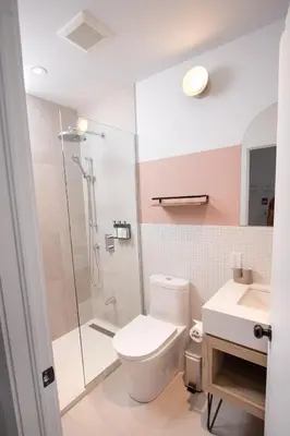 a bathroom with a toilet and a glass shower at Studio #12 - Self Check-In - Plateau - St-Denis in Montréal