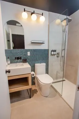 a bathroom with a toilet and a sink and a shower at Studio #13 - Self Check-In - Plateau - St-Denis in Montréal