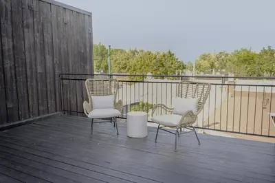 two chairs and a table on a deck at Studio #18 - Self Check-In - Plateau - St-Denis in Montréal