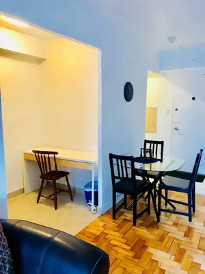 a dining room with a table and chairs at Stylish Montreal Apartment Comfortable Stay in the Golden Square Mile in Montréal