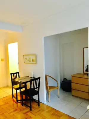 a dining room with a table and two chairs at Stylish Montreal Apartment Comfortable Stay in the Golden Square Mile in Montréal