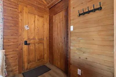 a wooden hallway with a door in a room at Chalet 3 - Domaine de l Archipel in Sorel