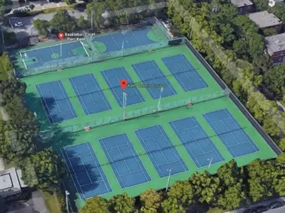 an overhead view of a tennis court with a red spot on it at Charming Vintage Home Park View Family-Ready in Montréal