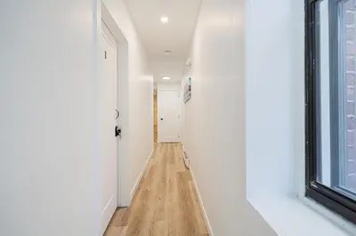 a hallway with white walls and a window at Room n3-Apartment 1 in a SHARED apartment in downtown Montreal in Montréal