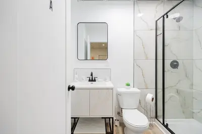 a bathroom with a toilet and a sink and a shower at Room n3-Apartment 1 in a SHARED apartment in downtown Montreal in Montréal