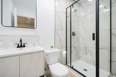 a bathroom with a shower and a toilet and a sink at Room in montreal in Montréal