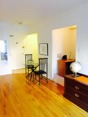a dining room with a glass table and chairs at Stylish Montreal Apartment Comfortable Stay in the Golden Square Mile in Montréal