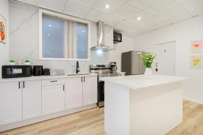 a kitchen with white cabinets and a white counter top at Chambre 2 - appartement 2 dans un appartement PARTAGÉ in Montréal