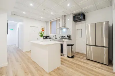 a kitchen with white counters and a refrigerator at Chambre 2 - appartement 2 dans un appartement PARTAGÉ in Montréal