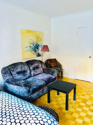 a living room with a couch and a coffee table at Modern Apartment City Living in the Golden Square Mile in Montréal