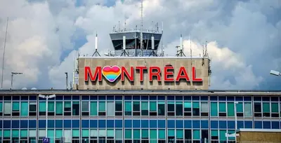 a mnet sign on the top of a building at Downtown Private Room & Workspace Metros Sherbrooke & Berri! Fast Wifi! in Montréal
