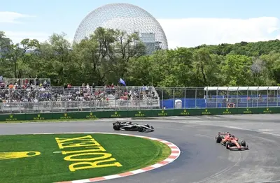 a group of race cars on a track with a crowd at McGill Les Petits Studios, Downtown & Nightlife in Montréal