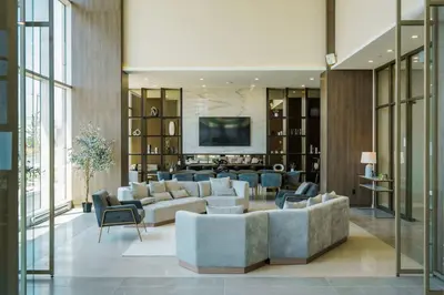 a living room with a couch and chairs and a tv at Corporate Stays Monarc Bedroom in Montréal