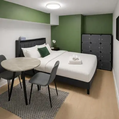 a bedroom with a large bed with a table and chairs at Fonctionnal Escape in Trendy Plateau Montreal in Montréal