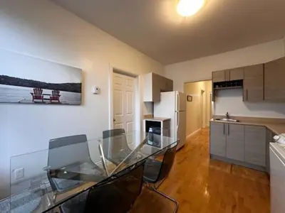 a kitchen with a glass table in a room at FULL KITCHEN 10min from DTOWN Room B in Montréal