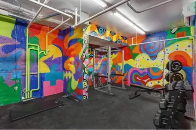 a room with a colorful painting on the wall at 209 - Modern Home Ambiance 2 BR with Gym,Parking,DT&Airport in Montréal