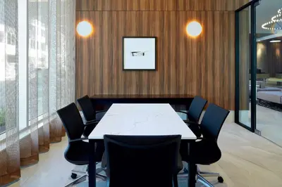 a conference room with a white table and chairs at Hilton Garden Inn Montreal Midtown, Quebec, Canada in Montréal