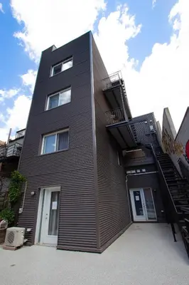 a black building with a staircase on the side of it at POP - SelfCheckIn - Rooftop - Terraces - St-Denis in Montréal