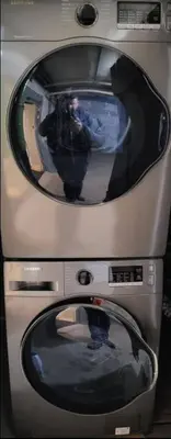 two old televisions with a person taking a picture at Cozy apartment in Ahuntsic with Free Parking and near metro station in Montréal