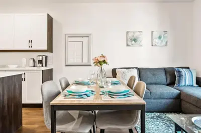 a living room with a table and a couch at Le Mile End by M11 - Upscale 1 BDR with Sofa Bed in Montréal