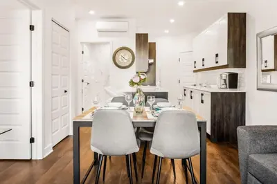 a kitchen and dining room with a table and chairs at Le Mile End by M11 - Upscale 1 BDR with Sofa Bed in Montréal